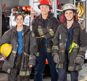 Firefighters in front of fire truck
